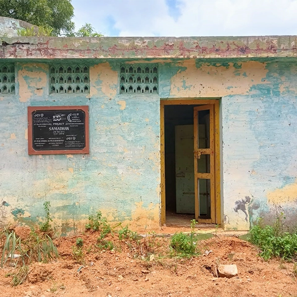 Unused and Damage Toilet in back side of the school near compound